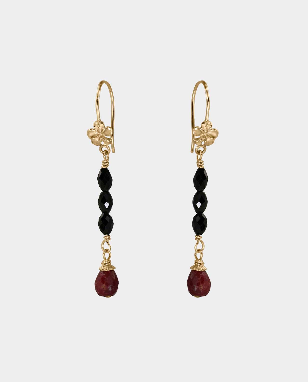 Earrings with rubies and black spinel where the jewelry designer's mode of expression shows her ambition to create jewels that tell their own story and where the jewelry becomes part of you and creates great satisfaction with yourself as a woman